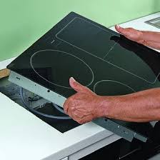 Pose de la nouvelle plaque de cuisson